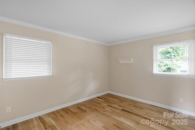 1607 Old Lawyers Rd, Marshville, NC 28103 - empty room featuring baseboards, light wood finished floors, and ornamental molding
