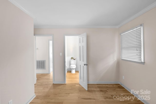 1607 Old Lawyers Rd, Marshville, NC 28103 - unfurnished bedroom featuring baseboards, ornamental molding, and light wood finished floors