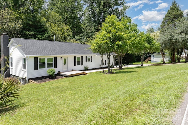 221 Belton Ave, Mount Holly, NC 28120 - view of front facade with a chimney, a front lawn, roof with shingles, and a deck