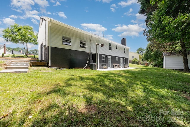 221 Belton Ave, Mount Holly, NC 28120 - back of property featuring a chimney and a yard