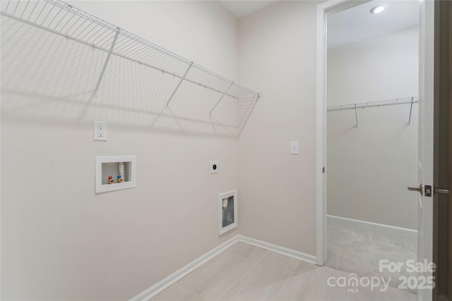 washroom with laundry area, hookup for a washing machine, baseboards, and hookup for an electric dryer