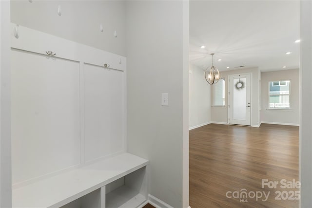 mudroom with baseboards, recessed lighting, wood finished floors, and a notable chandelier