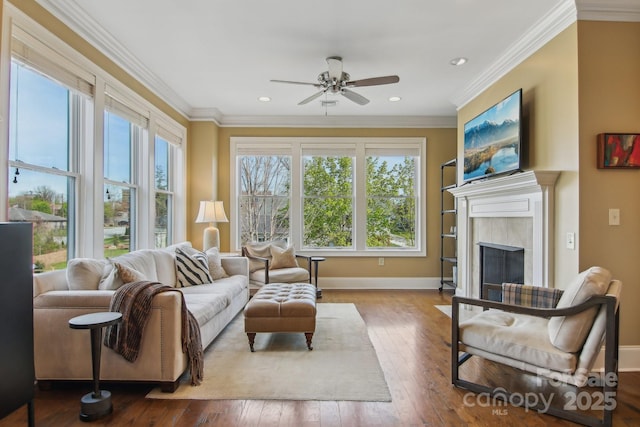 350 E Allen St Unit 201, Hendersonville, NC 28792 - living room with healthy amount of natural light, ceiling fan, crown molding, baseboards, and hardwood / wood-style floors