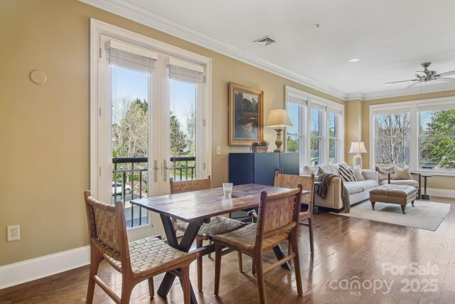 350 E Allen St Unit 201, Hendersonville, NC 28792 - dining space with healthy amount of natural light, baseboards, wood finished floors, ceiling fan, and ornamental molding