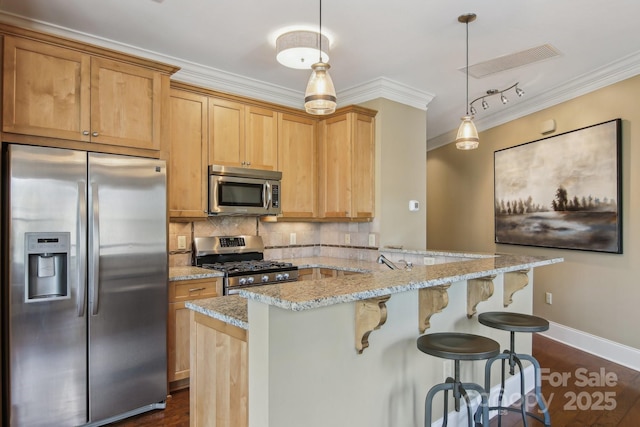 350 E Allen St Unit 201, Hendersonville, NC 28792 - kitchen with stainless steel appliances, ornamental molding, backsplash, a kitchen breakfast bar, and light stone countertops