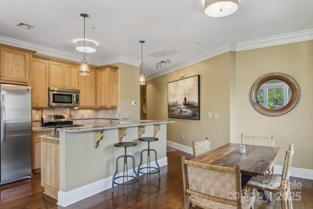 350 E Allen St Unit 201, Hendersonville, NC 28792 - kitchen with stainless steel appliances, a breakfast bar, light stone countertops, backsplash, and dark wood finished floors