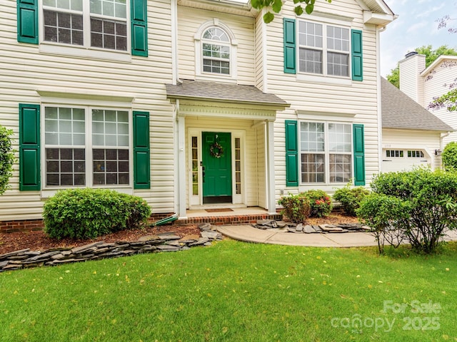 11719 Withers Mill Dr, Charlotte, NC 28278 - view of front of home with a front lawn, an attached garage, and roof with shingles