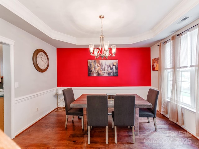 11719 Withers Mill Dr, Charlotte, NC 28278 - dining space featuring a raised ceiling, a notable chandelier, a wealth of natural light, and wood finished floors