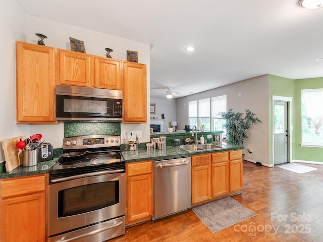 11719 Withers Mill Dr, Charlotte, NC 28278 - kitchen with recessed lighting, a sink, stainless steel appliances, ceiling fan, and a peninsula
