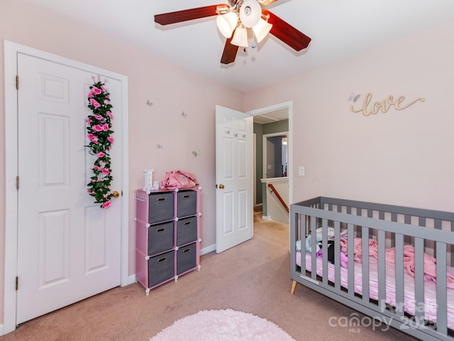 11719 Withers Mill Dr, Charlotte, NC 28278 - bedroom featuring a ceiling fan, a nursery area, and light carpet