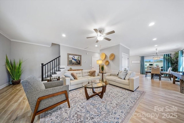 360 N Broad St, Waxhaw, NC 28173 - living room with crown molding, stairs, ceiling fan, and light wood-type flooring