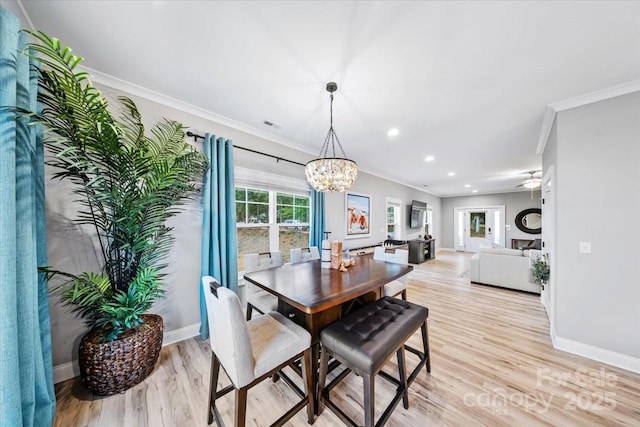 360 N Broad St, Waxhaw, NC 28173 - dining area with baseboards, ceiling fan with notable chandelier, ornamental molding, recessed lighting, and light wood-style flooring