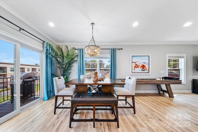 360 N Broad St, Waxhaw, NC 28173 - dining area with an inviting chandelier, recessed lighting, crown molding, and light wood-type flooring