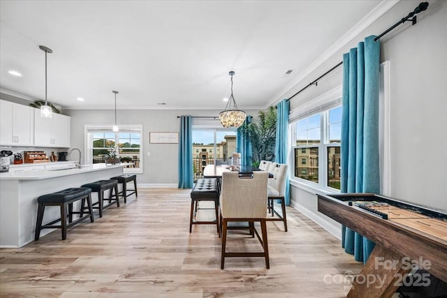 360 N Broad St, Waxhaw, NC 28173 - dining room featuring an inviting chandelier, light wood-style flooring, recessed lighting, baseboards, and ornamental molding