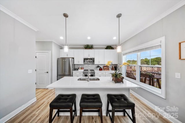 360 N Broad St, Waxhaw, NC 28173 - kitchen with appliances with stainless steel finishes, a sink, light countertops, decorative backsplash, and ornamental molding