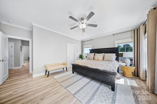 360 N Broad St, Waxhaw, NC 28173 - bedroom featuring crown molding, a ceiling fan, baseboards, and light wood-style flooring