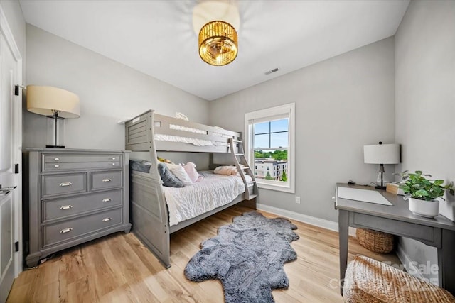 360 N Broad St, Waxhaw, NC 28173 - bedroom featuring baseboards, visible vents, and light wood finished floors