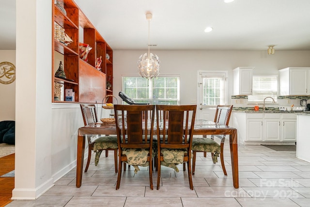 dining space with recessed lighting, an inviting chandelier, and visible vents