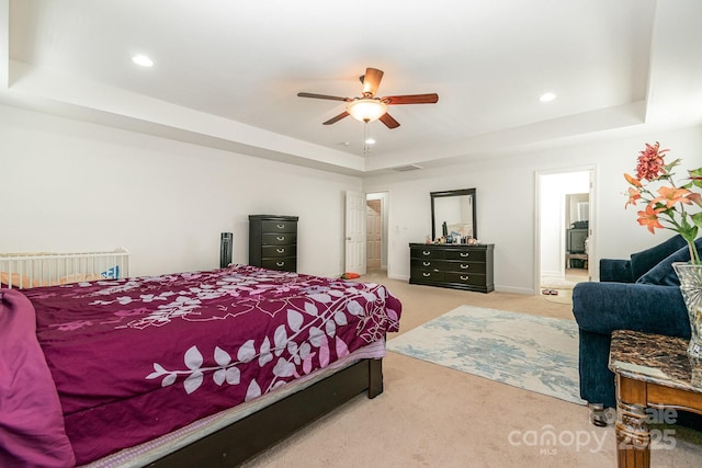 carpeted bedroom with recessed lighting, a raised ceiling, ceiling fan, and baseboards