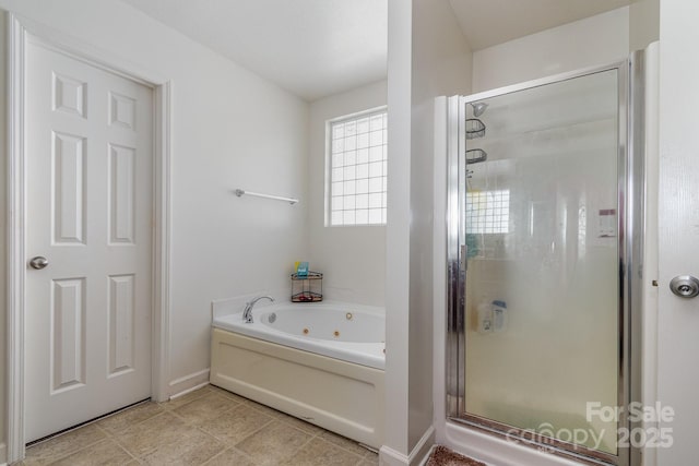 full bath with a jetted tub, baseboards, and a stall shower