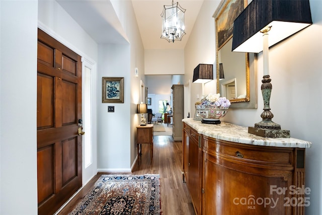 5128 Dunes Ct, Charlotte, NC 28226 - foyer entrance with dark wood-style flooring, a chandelier, and baseboards