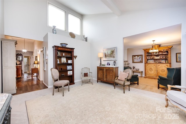 5128 Dunes Ct, Charlotte, NC 28226 - living area with a towering ceiling, wood finished floors, and beamed ceiling