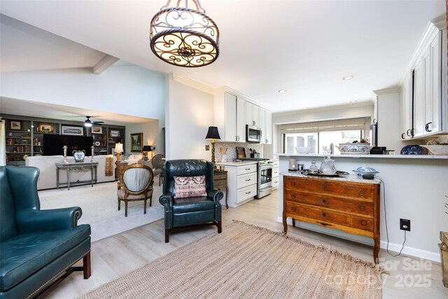 5128 Dunes Ct, Charlotte, NC 28226 - living area featuring light wood-style floors, ceiling fan, and ornamental molding