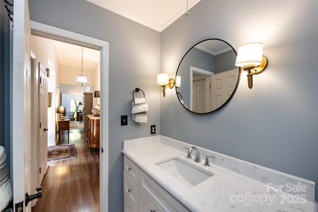5128 Dunes Ct, Charlotte, NC 28226 - bathroom featuring wood finished floors, crown molding, and vanity