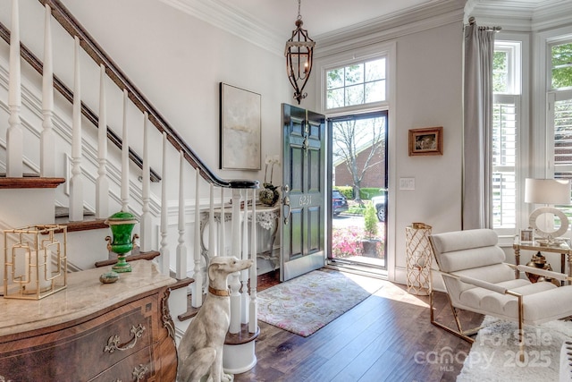 6231 Wakehurst Rd, Charlotte, NC 28226 - foyer entrance with stairway, a wealth of natural light, hardwood / wood-style floors, and ornamental molding