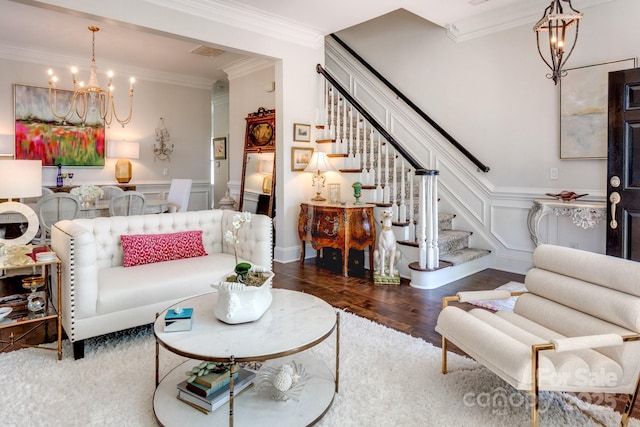 6231 Wakehurst Rd, Charlotte, NC 28226 - living area with stairway, ornamental molding, a notable chandelier, and a decorative wall