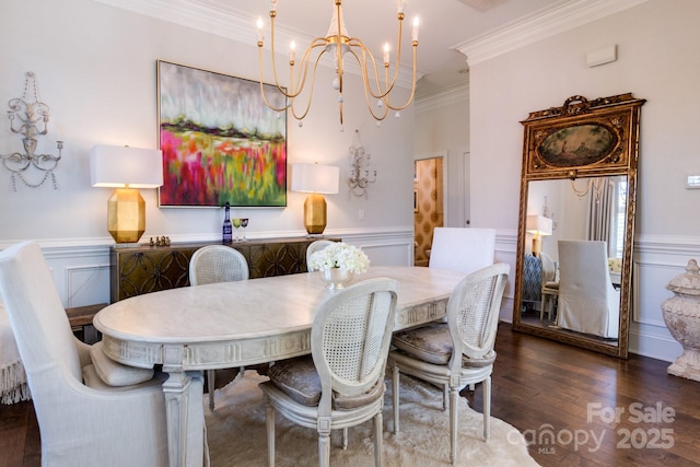 6231 Wakehurst Rd, Charlotte, NC 28226 - dining room featuring a chandelier, wood finished floors, a wainscoted wall, and crown molding