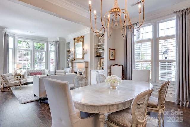 6231 Wakehurst Rd, Charlotte, NC 28226 - dining space featuring visible vents, an inviting chandelier, a healthy amount of sunlight, and ornamental molding