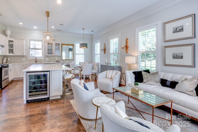 6231 Wakehurst Rd, Charlotte, NC 28226 - living area featuring dark wood-style floors, recessed lighting, crown molding, and wine cooler