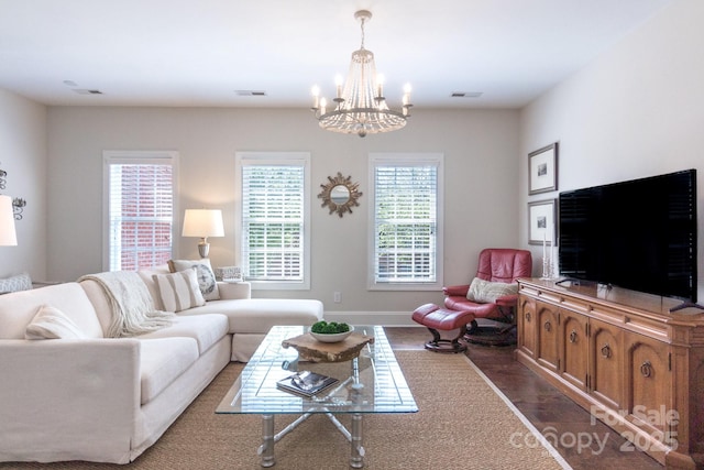 6231 Wakehurst Rd, Charlotte, NC 28226 - living room with an inviting chandelier, visible vents, and dark wood finished floors
