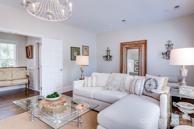 6231 Wakehurst Rd, Charlotte, NC 28226 - living room with a chandelier, visible vents, and wood finished floors