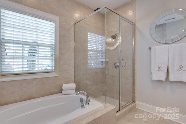 6231 Wakehurst Rd, Charlotte, NC 28226 - full bath featuring a stall shower, a bath, tile patterned floors, and baseboards