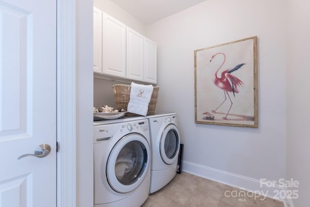 6231 Wakehurst Rd, Charlotte, NC 28226 - washroom featuring light tile patterned floors, washing machine and dryer, cabinet space, and baseboards