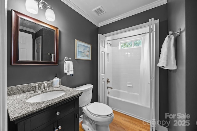 full bathroom with vanity, toilet, wood finished floors, visible vents, and ornamental molding