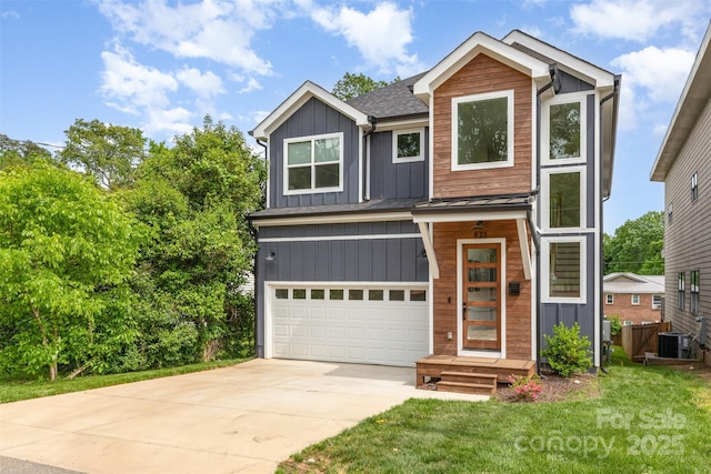view of front facade with a garage, concrete driveway, board and batten siding, cooling unit, and a front yard