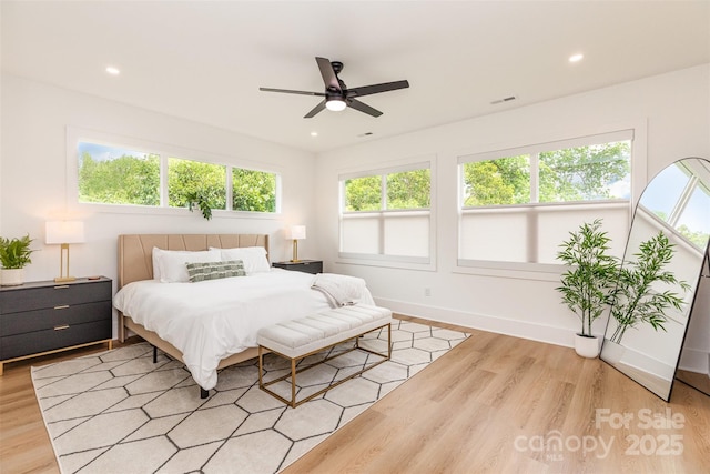 bedroom with light wood-style flooring, baseboards, recessed lighting, and ceiling fan