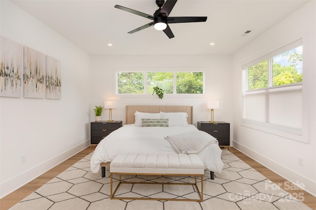bedroom with recessed lighting, baseboards, a ceiling fan, and light wood-type flooring