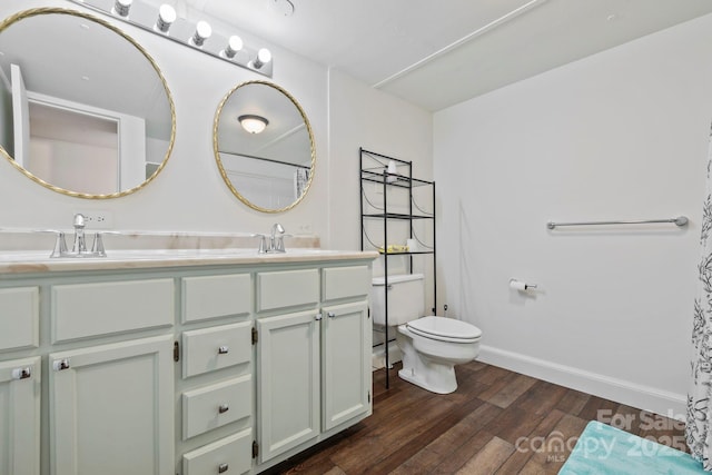 456 Newtown Rd, Rosman, NC 28772 - full bathroom featuring wood finished floors, a sink, double vanity, and toilet