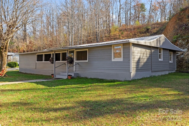 456 Newtown Rd, Rosman, NC 28772 - single story home with a front lawn and metal roof