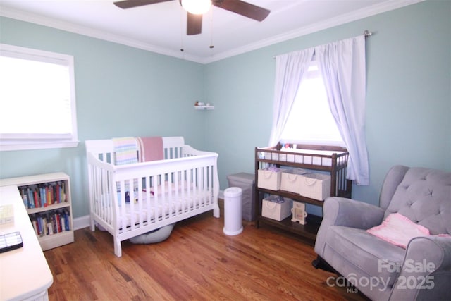 201 Mitchell St, Belmont, NC 28012 - bedroom featuring wood finished floors, a crib, ceiling fan, and ornamental molding