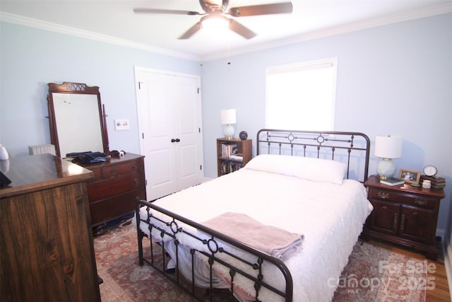 201 Mitchell St, Belmont, NC 28012 - bedroom featuring wood finished floors, a closet, a ceiling fan, and ornamental molding