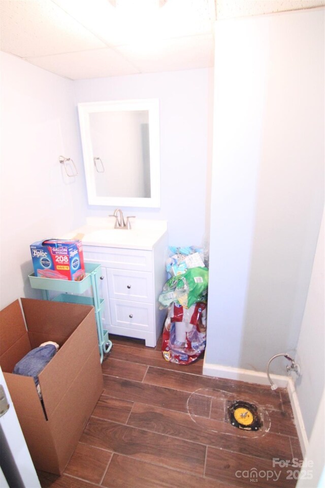 201 Mitchell St, Belmont, NC 28012 - bathroom with baseboards, wood finished floors, and vanity
