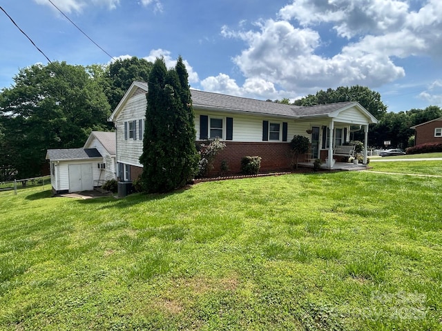201 Mitchell St, Belmont, NC 28012 - single story home with a porch, a front lawn, brick siding, and a shed
