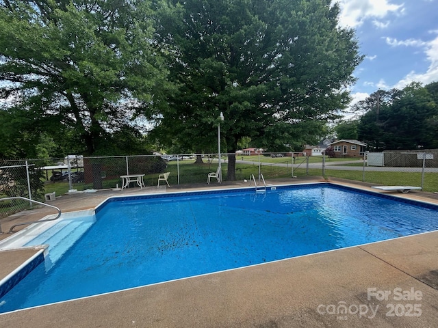 201 Mitchell St, Belmont, NC 28012 - view of pool with fence, a fenced in pool, and a diving board