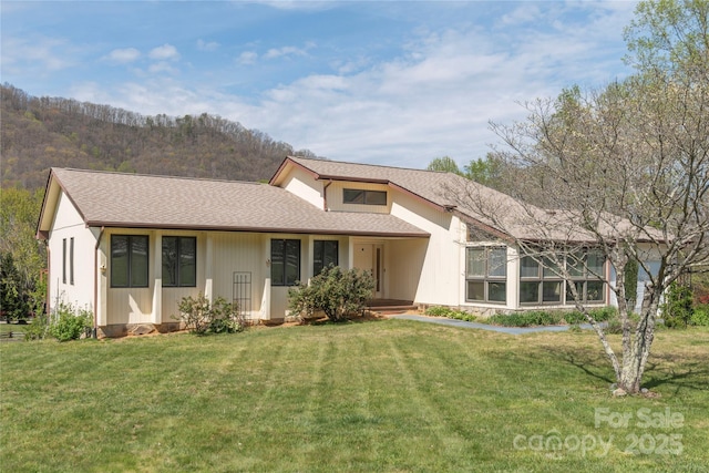 196 Timberline Dr, Maggie Valley, NC 28751 - view of front of home with a front lawn and a shingled roof