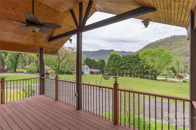 196 Timberline Dr, Maggie Valley, NC 28751 - wooden deck with a mountain view, a ceiling fan, and a yard